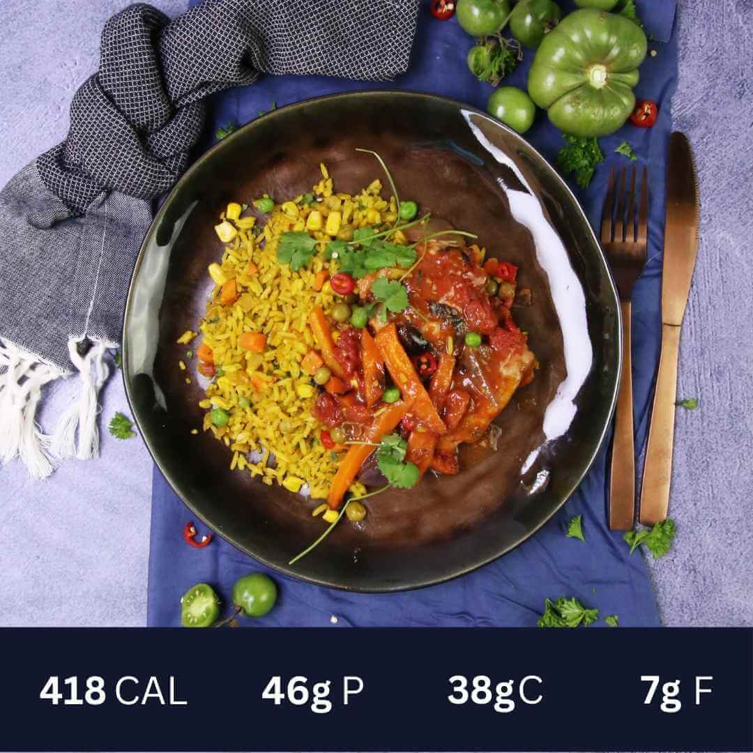 Spanish Chicken and Saffron Rice. Succulent chicken cooked in a Spanish red sauce with carrots, capsicum and mushroom on a bed of fragrant saffron spiced rice.